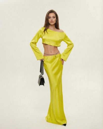 Lana Midi Dress by RAMBLION in vibrant yellow, featuring a slash neckline and elegant silhouette, perfect for bold occasions.
