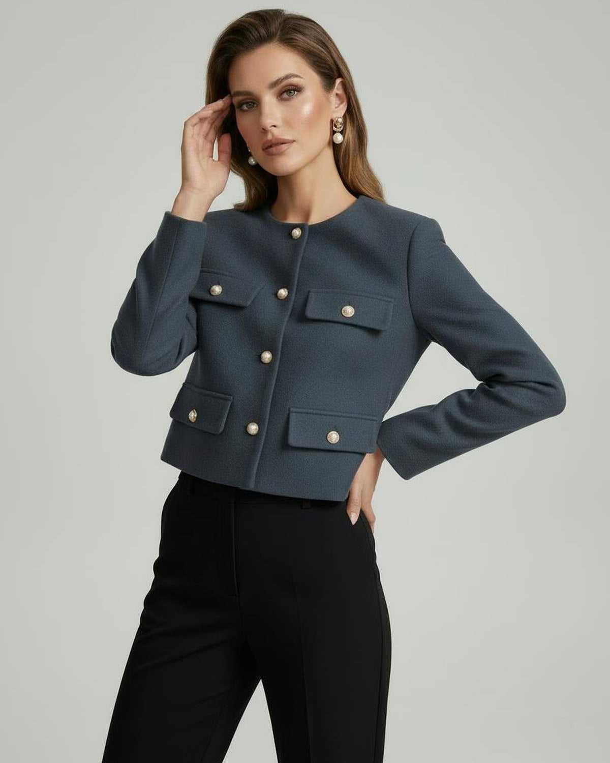 Rage Jacket by RAMBLION in slate blue, featuring gold-tone buttons and structured design, perfect for chic occasions.