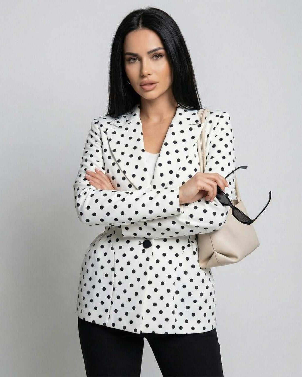 Rina Jacket by RAMBLION, white with black polka dots, stylish, elegant, perfect for modern occasions.