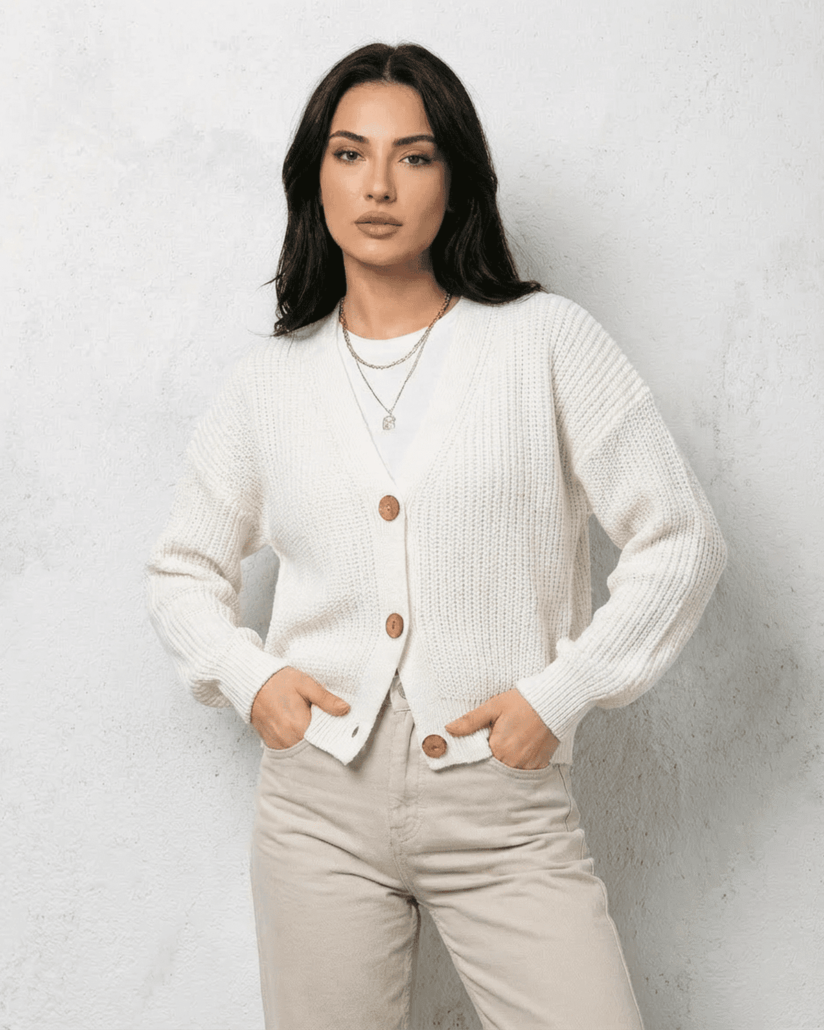 Alba Cardigan by RAMBLION in classic white with soft V-neck and button details, perfect for layered fall styles.