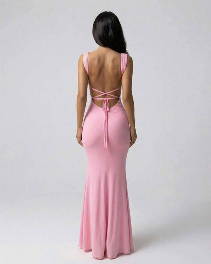Ales Maxi Dress in soft pink, showcasing an elegant back design, perfect for chic occasions. RAMBLION brand.