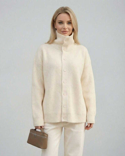 Ana Sweater by RAMBLION, white ribbed sweater with high collar, perfect for chilly evenings and stylish outings.