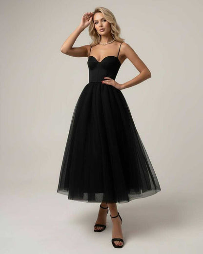 Ancy Midi Dress by RAMBLION, elegant black strapless dress with tulle skirt, perfect for sophisticated occasions.