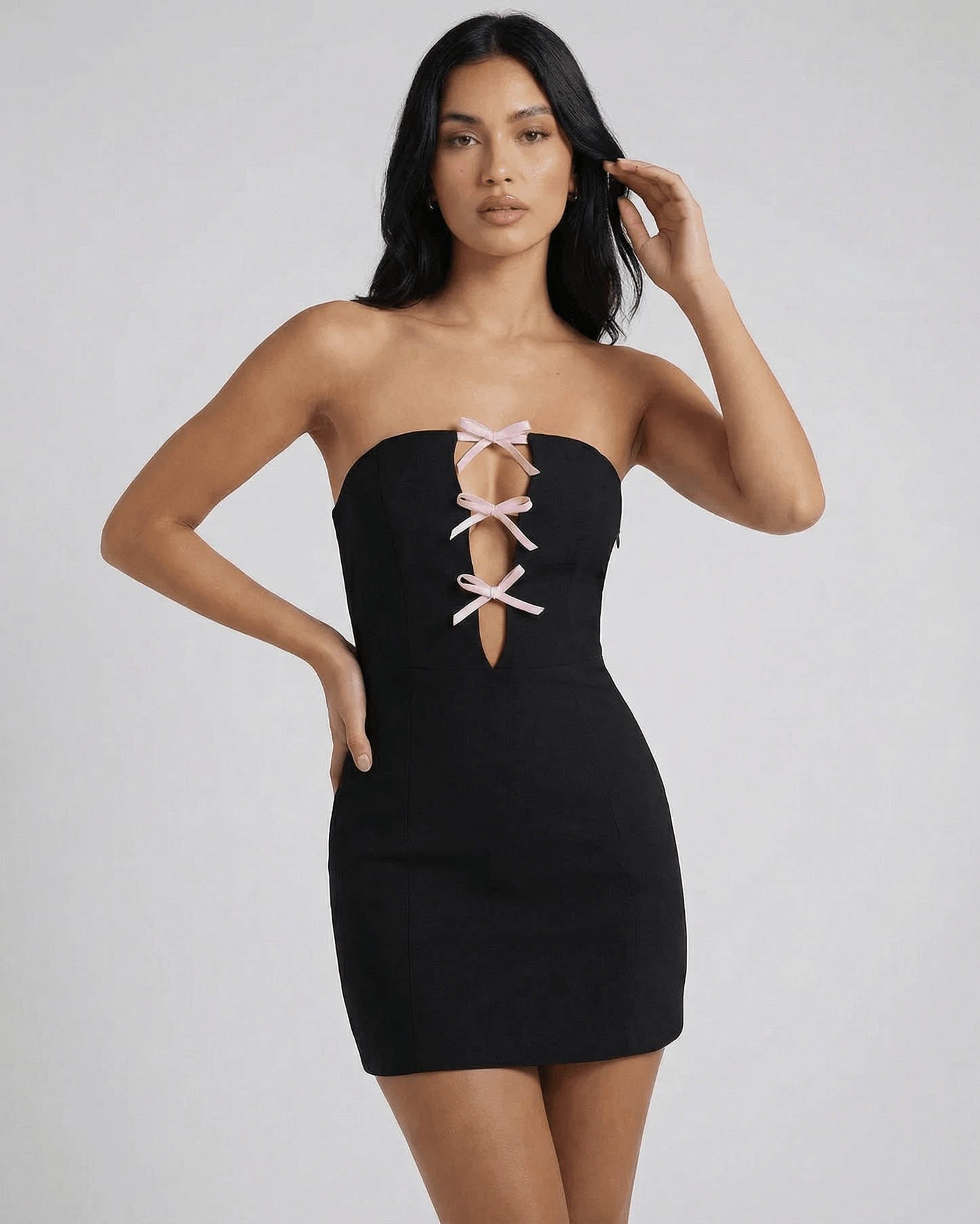 Anfa Mini Dress - Black strapless design with chic bow detail, perfect for modern occasions by RAMBLION.