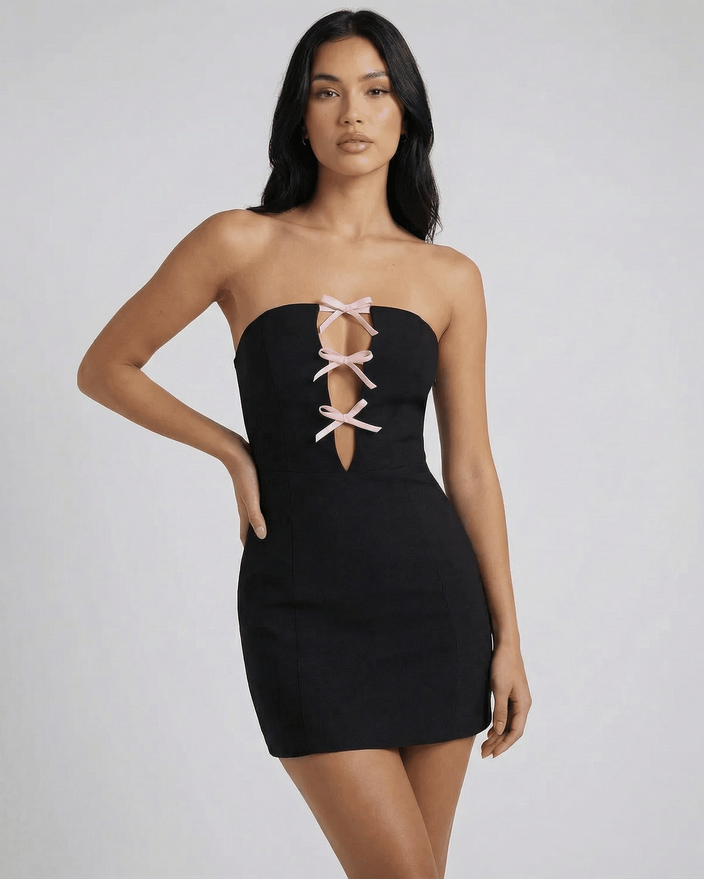 Anfa Mini Dress - Black strapless mini dress by RAMBLION with chic bow detail, perfect for sophisticated occasions.