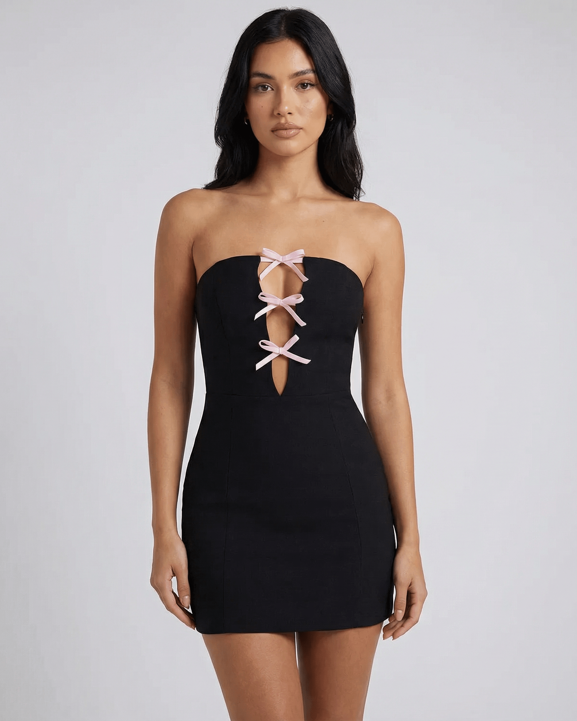 Anfa Mini Dress - Black strapless dress with feminine bow detail, perfect for chic occasions by RAMBLION.
