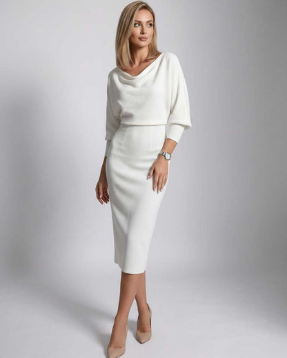 Ramblion Anya midi dress — cowl neck neckline · back view · styled for cocktail season