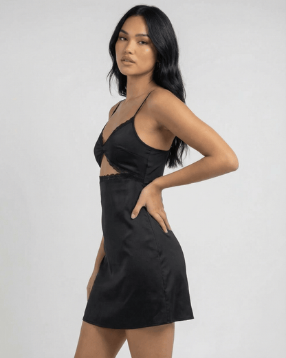 Baux Mini Dress by RAMBLION, elegant black satin with V-neck and lace trim, perfect for summer outings and evening events.