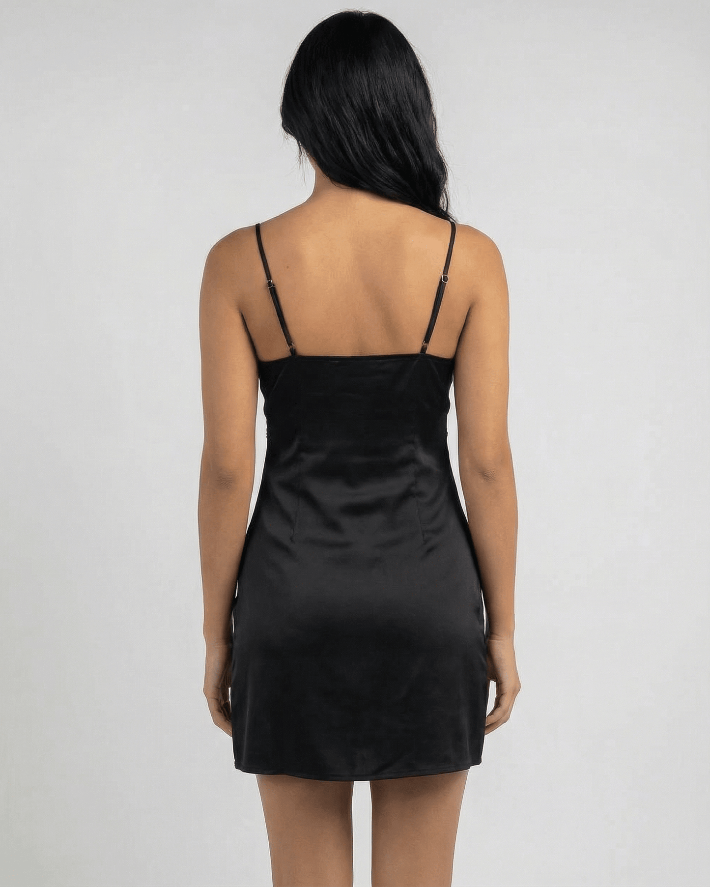 Baux Mini Dress black satin with V-neck, elegant summer wear, above-knee length, by RAMBLION.