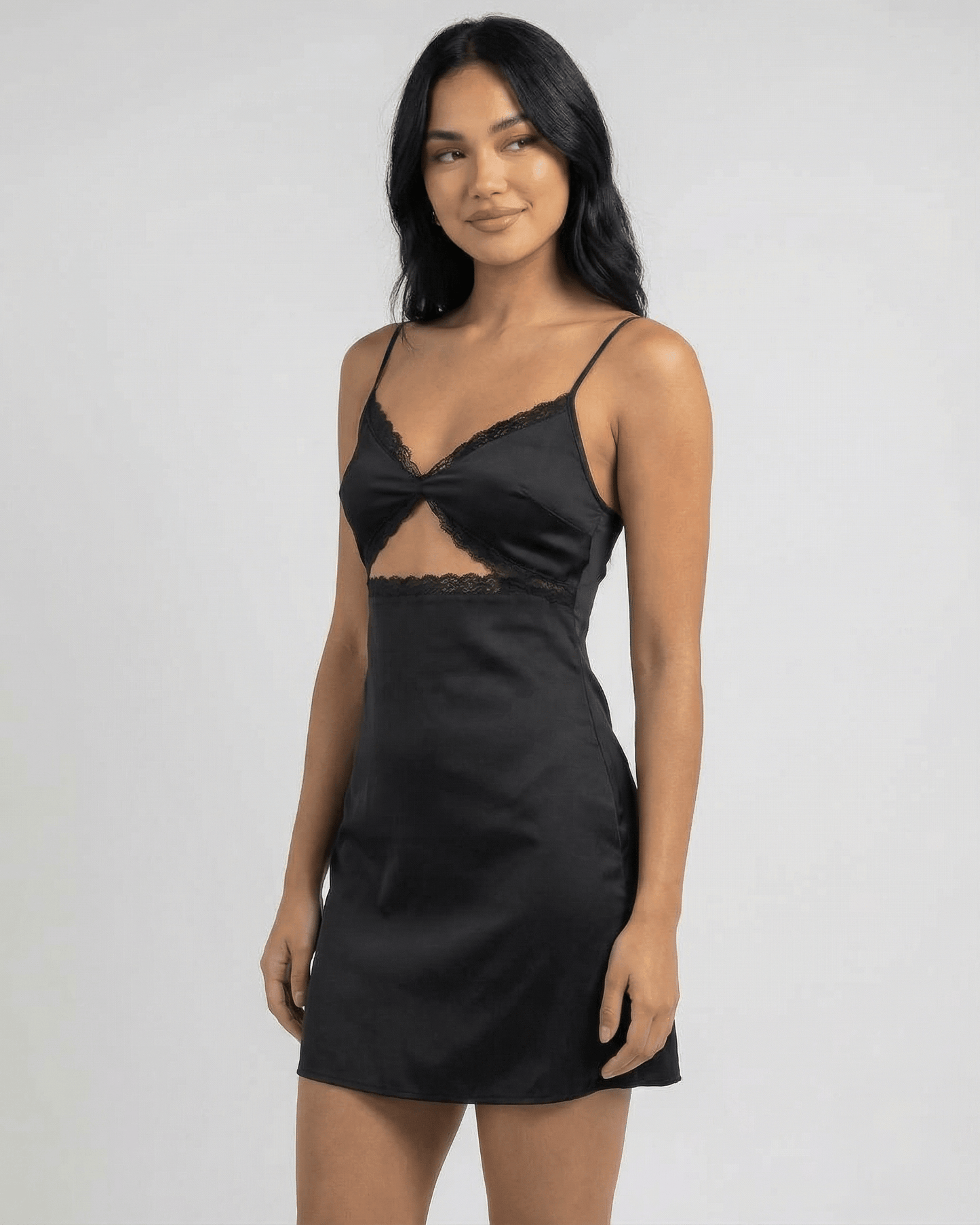Baux Mini Dress by RAMBLION in black satin with lace-trimmed V-neck, perfect for summer outings or elegant evenings.