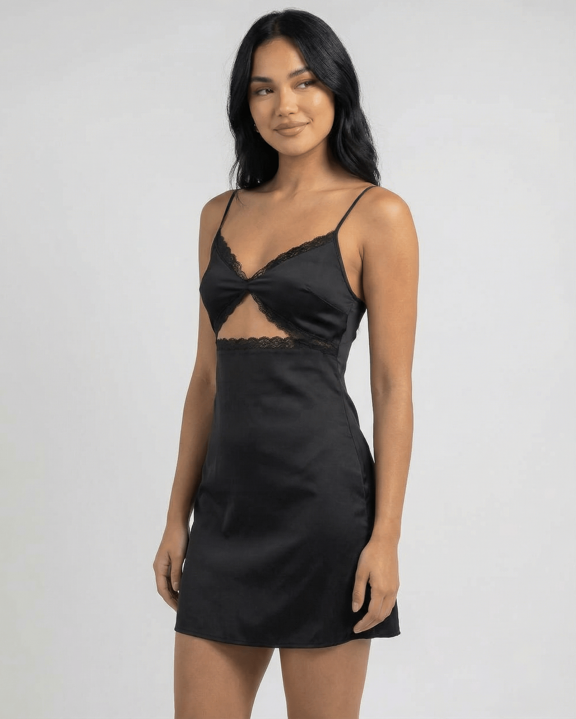 Baux Mini Dress by RAMBLION in black satin with lace-trimmed V-neck, perfect for summer outings or elegant evenings.