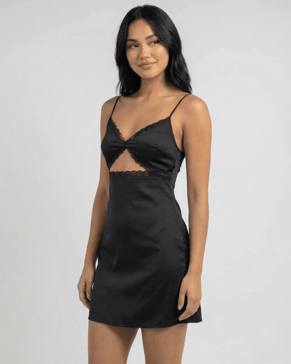 Baux Mini Dress by RAMBLION in black satin with lace-trimmed V-neck, perfect for summer outings or elegant evenings.