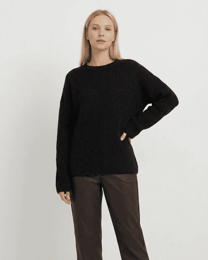 Beja Sweater in black, featuring soft ribbed knit design for cozy comfort by RAMBLION, perfect for cooler occasions.