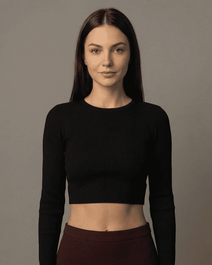 Merlot Maxi Skirt model wearing high-waisted black crop top with long sleeves and minimalist style.