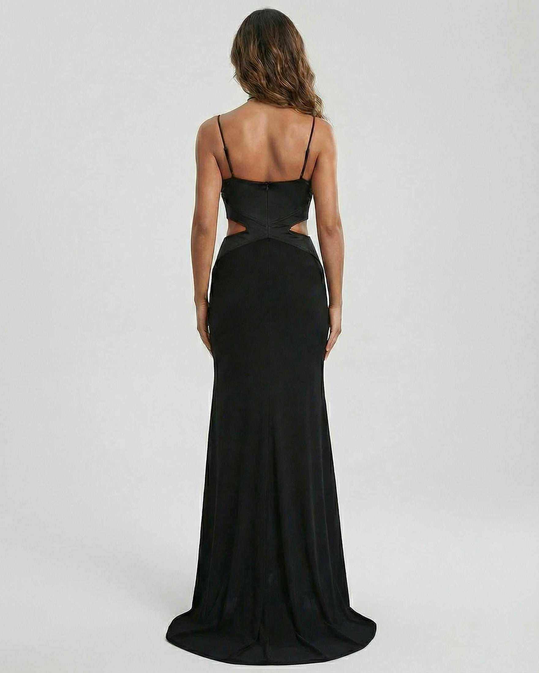 Back view of the RAMBLION Jersey Maxi Dress, a black ankle-length, strapless evening gown featuring a contemporary silhouette.
