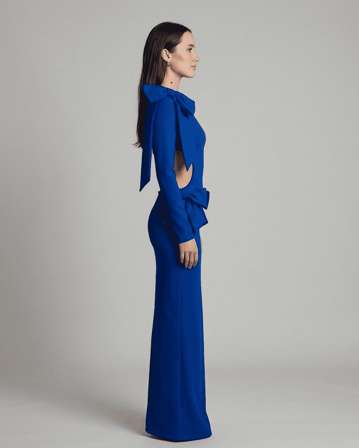 Bonn Maxi Dress in vibrant blue featuring bow accents and cut-out waist for refined elegance by RAMBLION.
