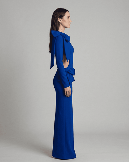 Bonn Maxi Dress in vibrant blue featuring bow accents and cut-out waist for refined elegance by RAMBLION.