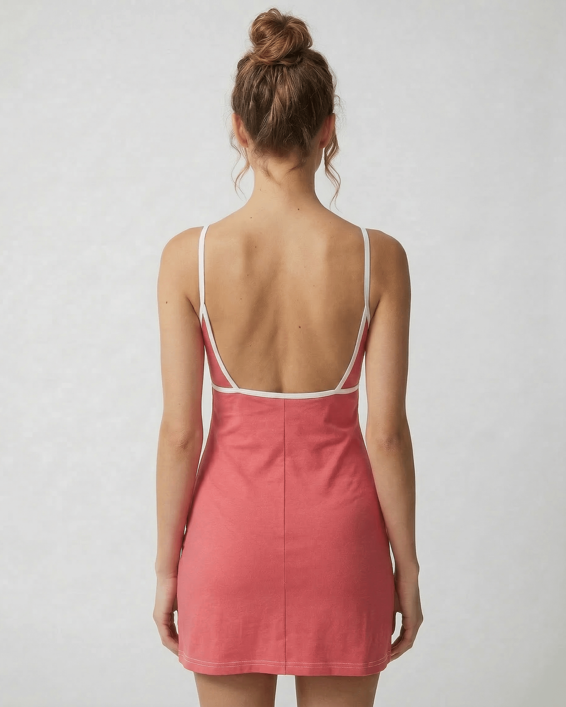 Calo Mini Dress back view showing round neck, playful patchwork design, and soft polyester blend by RAMBLION.