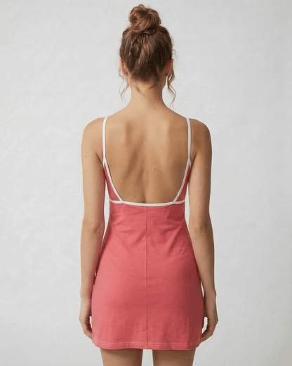 Calo Mini Dress back view showing round neck, playful patchwork design, and soft polyester blend by RAMBLION.