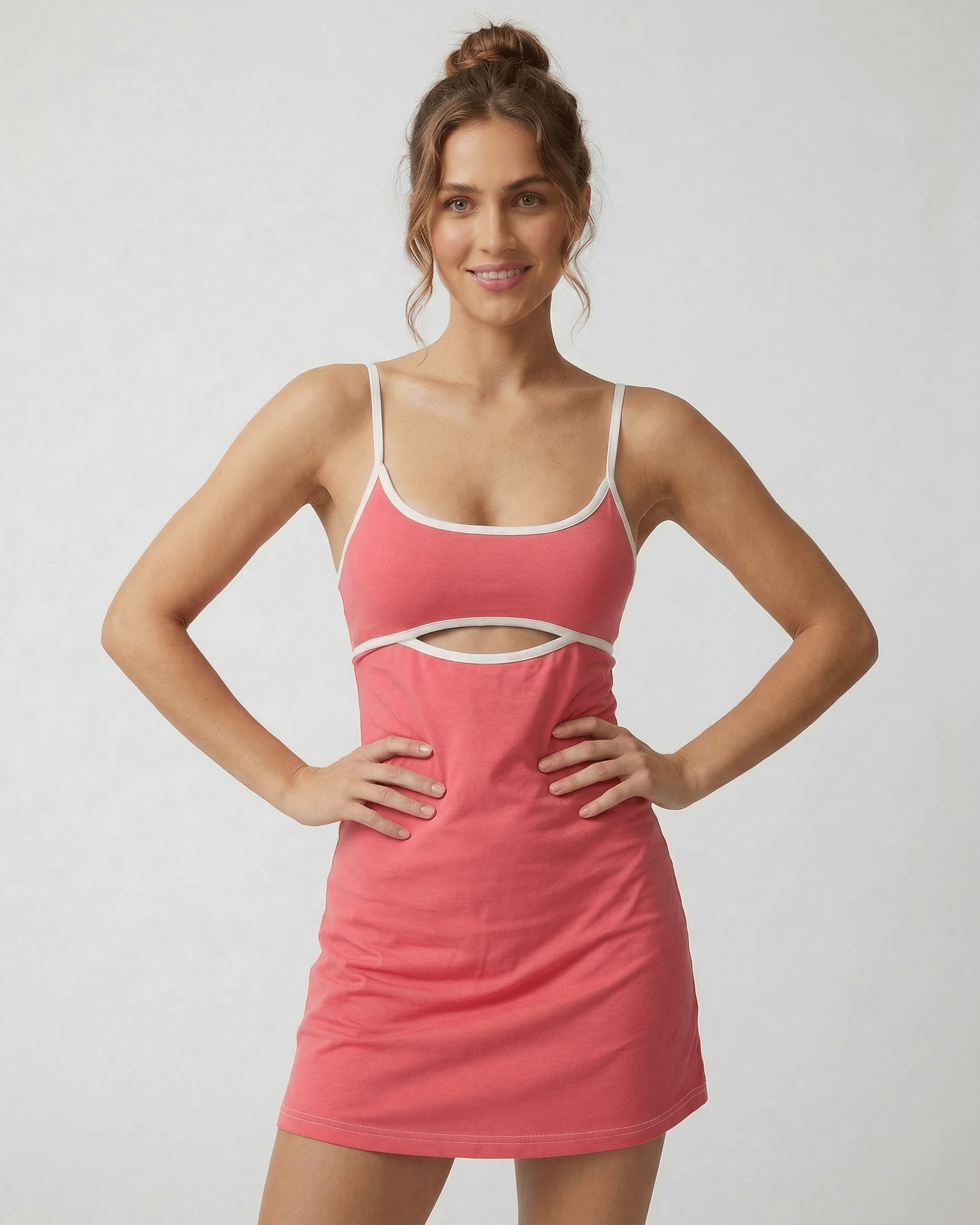 Calo Mini Dress by RAMBLION in vibrant pink, featuring a round neck, playful patchwork, and hollow-out detail for warm weather.