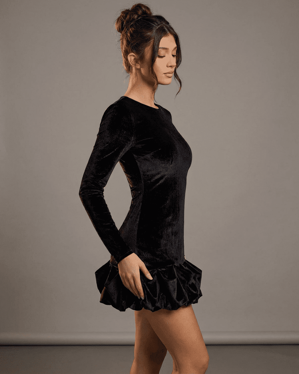 Canu Mini Dress by RAMBLION, a black velvet mini dress with a crew neck, long sleeves, and stylish ruffled hem.