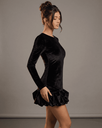 Canu Mini Dress by RAMBLION, a black velvet mini dress with a crew neck, long sleeves, and stylish ruffled hem.