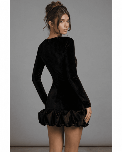 Canu Mini Dress featuring a luxurious black polyester velvet fabric, long sleeves, and a playful ruffled hem by RAMBLION.