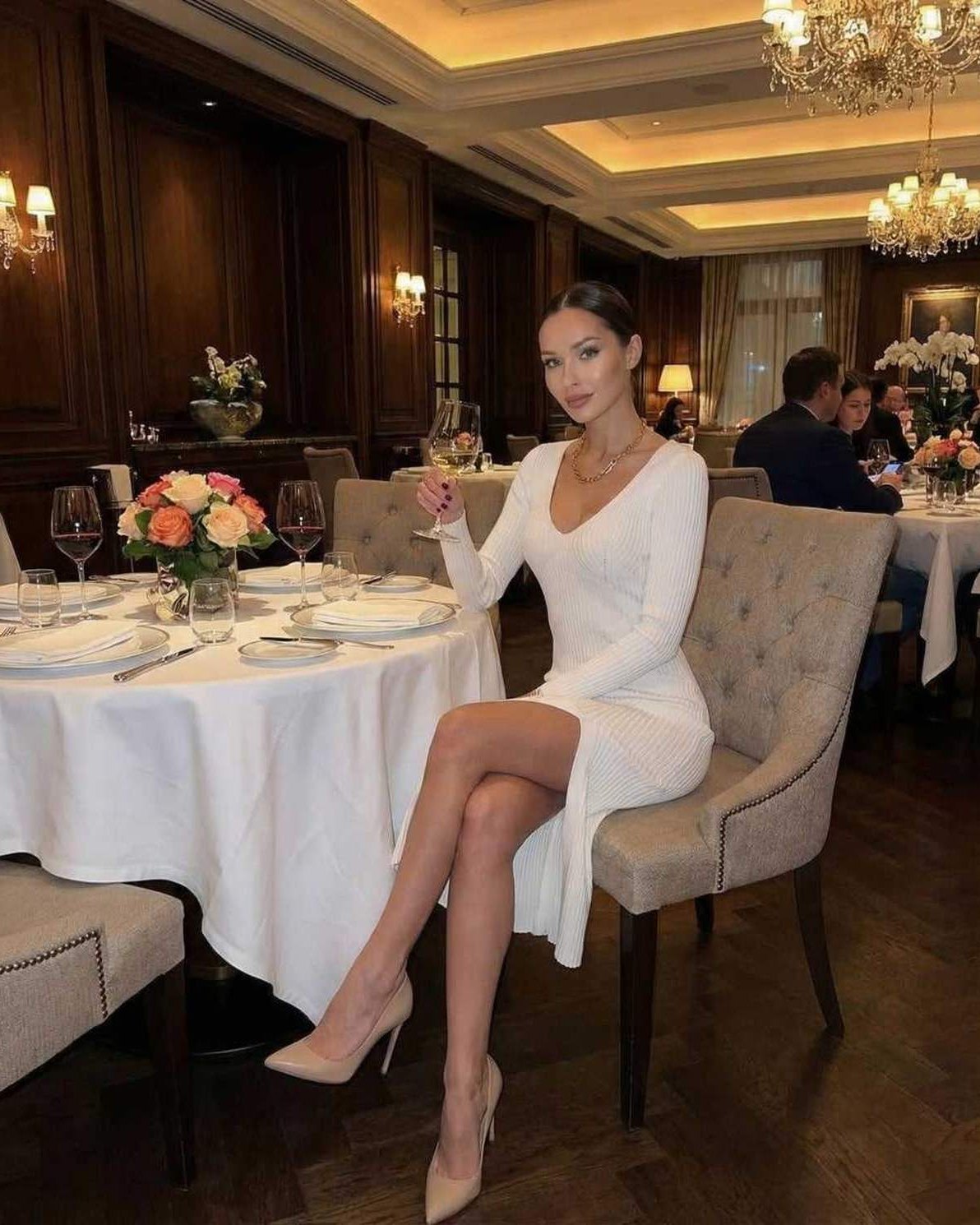 Chic Carp Midi Dress in white V-neck style, perfect for elegant dining occasions, featuring modern ribbed knit by RAMBLION.