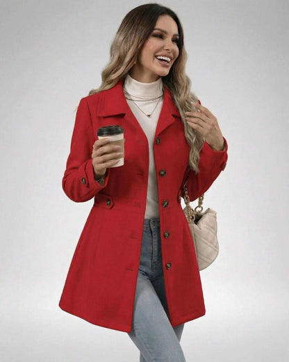 Model wearing a Crimson Sculpt Jacket in red, holding a coffee, showcasing a stylish, slim fit look.