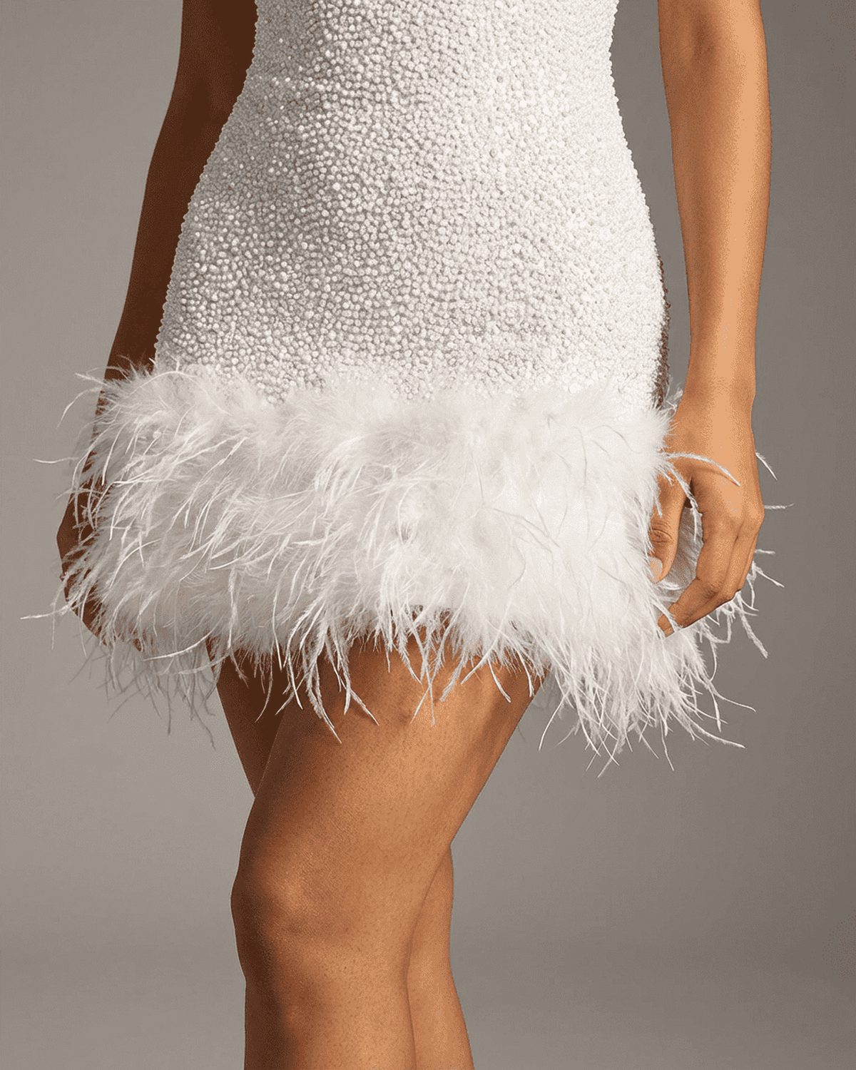 Dany Mini Dress featuring a sleeveless design, sequin overlay, feather trim, perfect for glamorous occasions by RAMBLION.