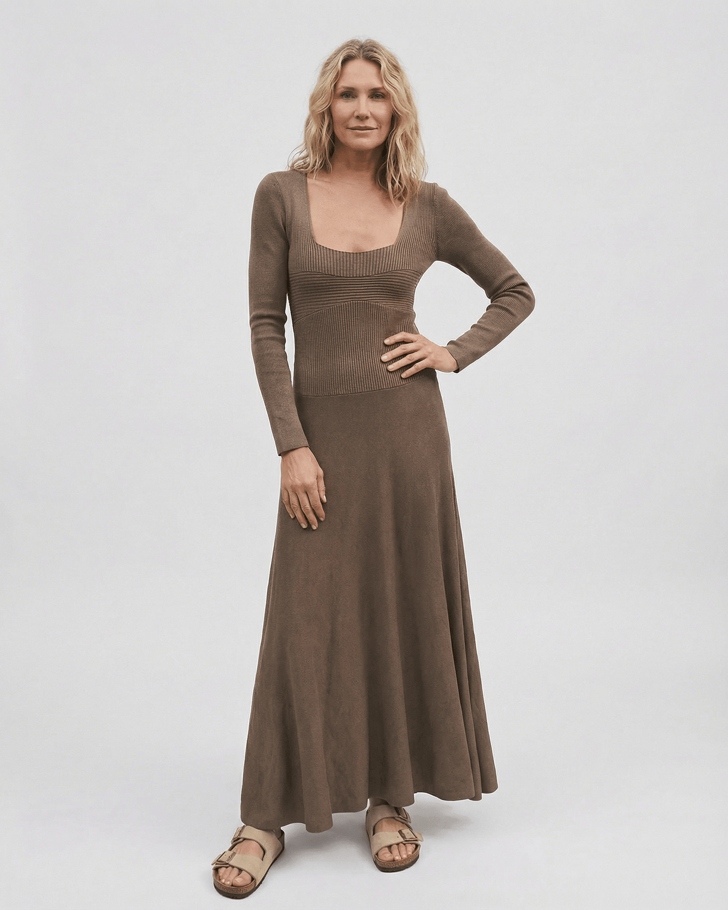 Darp Maxi Dress in brown with square neck, long sleeves, pleated silhouette, perfect for stylish occasions. RAMBLION brand.