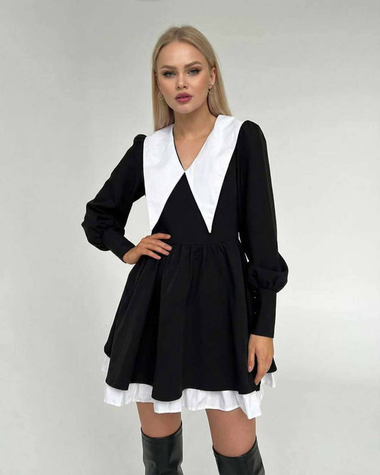Drue Mini Dress featuring black and white patchwork, V-neck, elegant design perfect for gatherings, by RAMBLION.