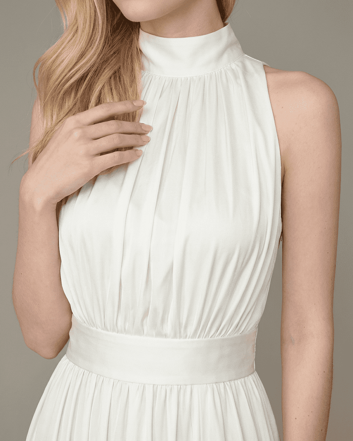 Elara Maxi Dress by RAMBLION showcasing the elegant sleeveless turtleneck and pleated design in a smooth white finish.