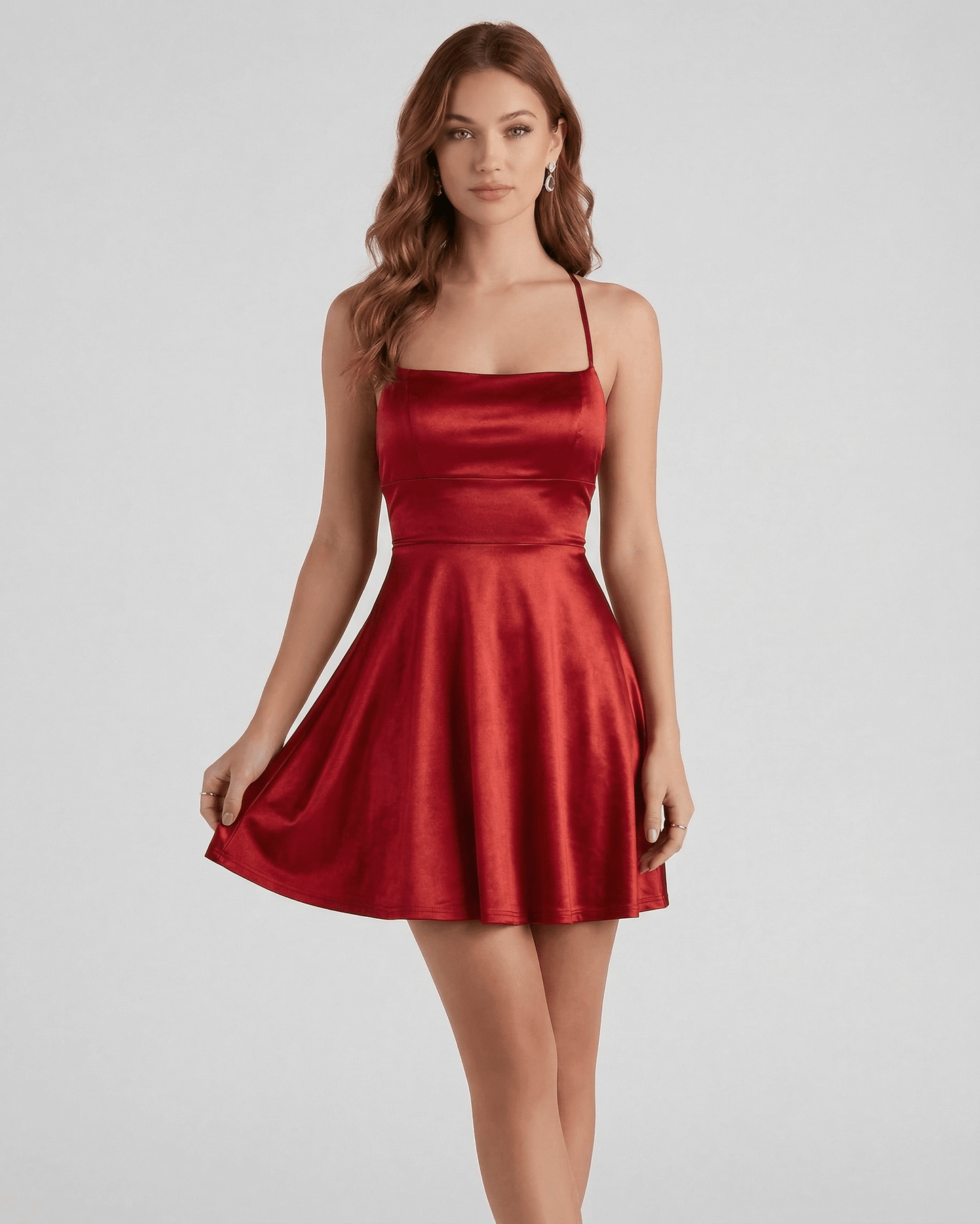 Elbe Mini Dress in ruby red satin, with A-line silhouette for a chic, playful look. Perfect for special occasions. By RAMBLION.