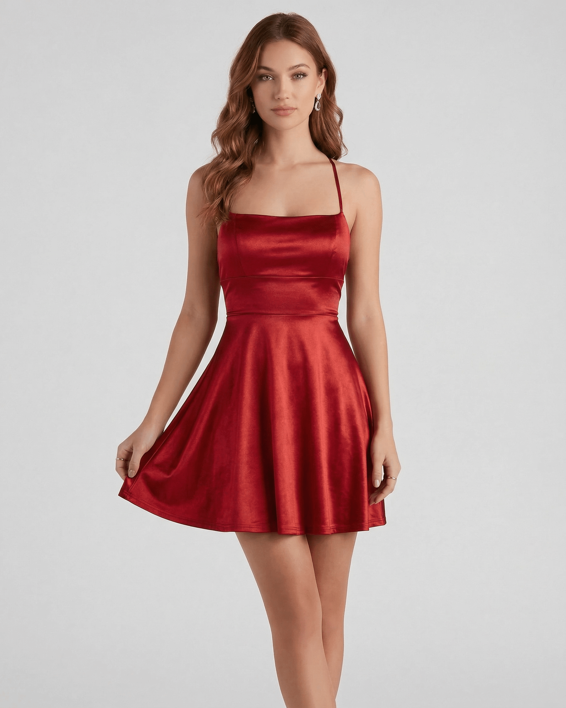 Elbe Mini Dress in ruby red satin, with A-line silhouette for a chic, playful look. Perfect for special occasions. By RAMBLION.