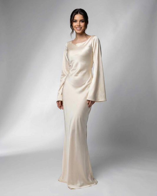 Elbi Maxi Dress in luxurious beige satin with boat neck and flowing silhouette, perfect for formal occasions by RAMBLION.