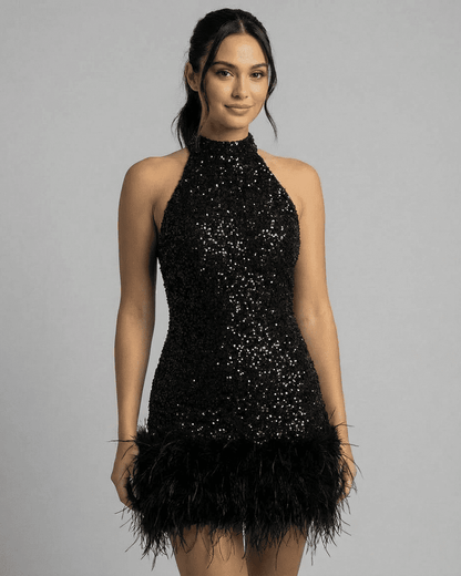 Elsa Mini Dress in black sequins and feather hem, perfect for events. RAMBLION, halter neckline, glamorous and stylish.