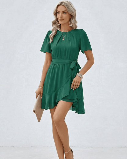 Enora Mini Dress: Green satin mini dress with flutter sleeves, perfect for elegant occasions. RAMBLION brand.