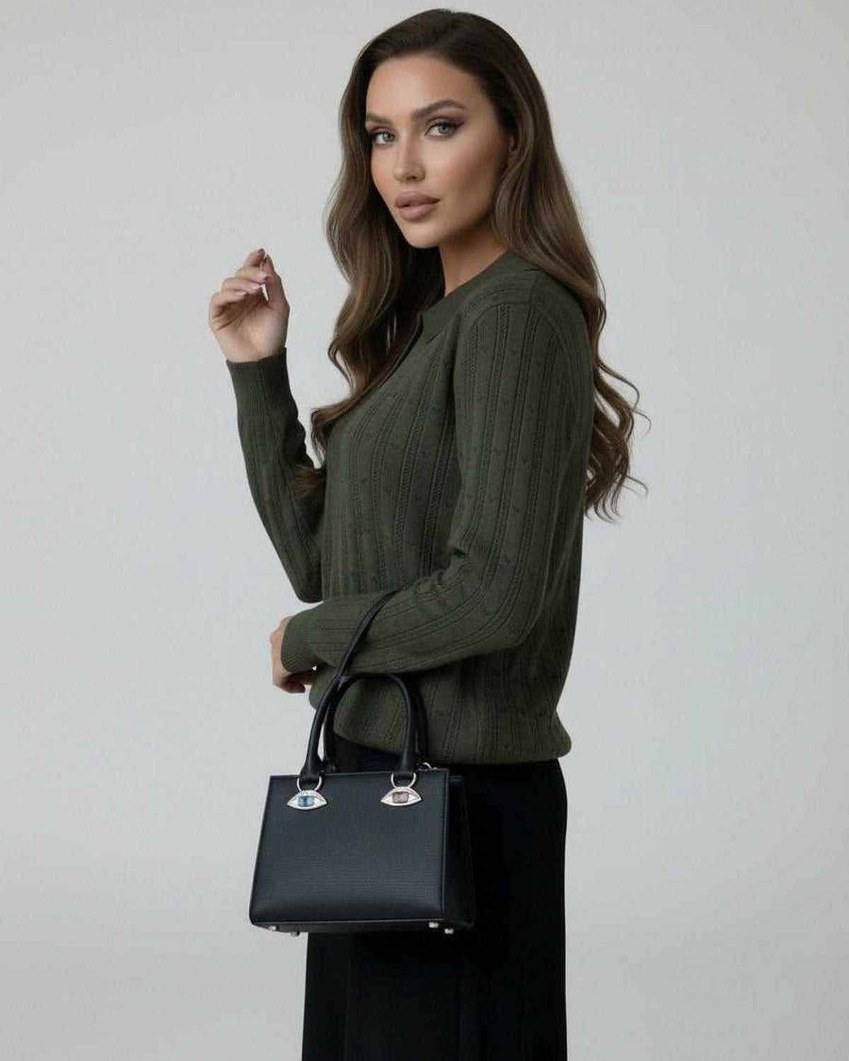 Enora Sweater in olive green, featuring ribbed texture, styled with a black handbag, perfect for fall occasions.