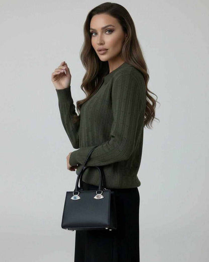 Enora Sweater in olive green, featuring ribbed texture, styled with a black handbag, perfect for fall occasions.