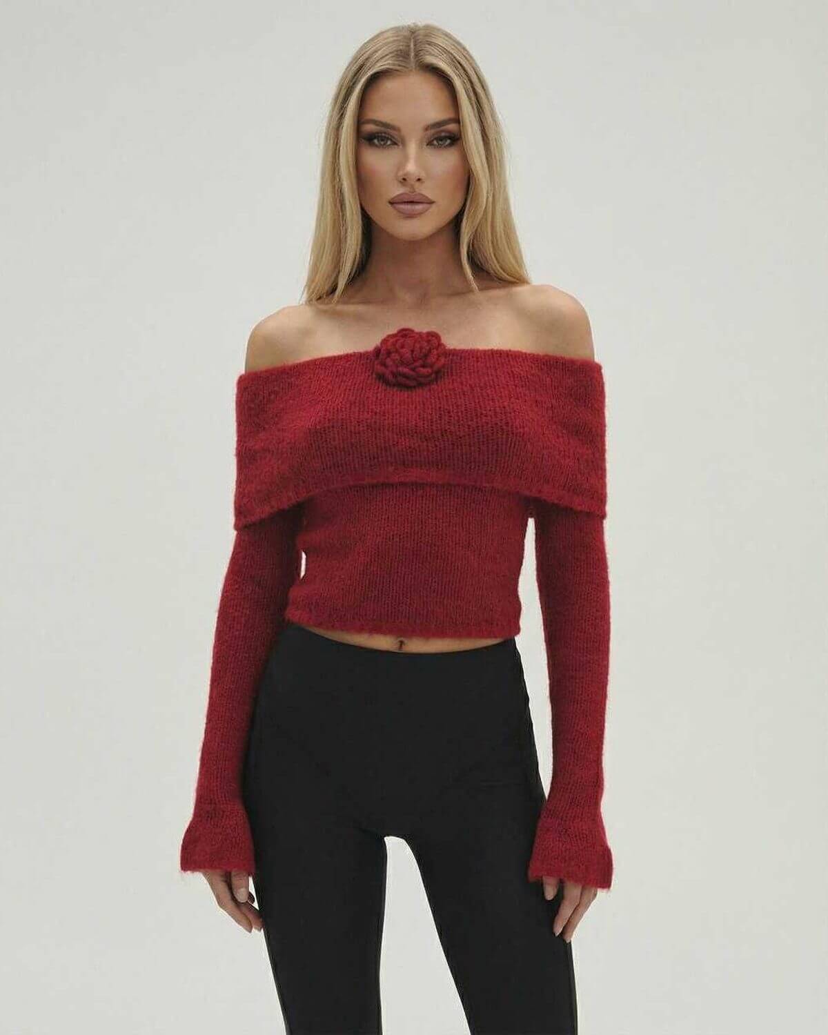 Eva Pullover by RAMBLION, a red off-the-shoulder knit top, stylish for fall and winter, offering comfort and sophistication.