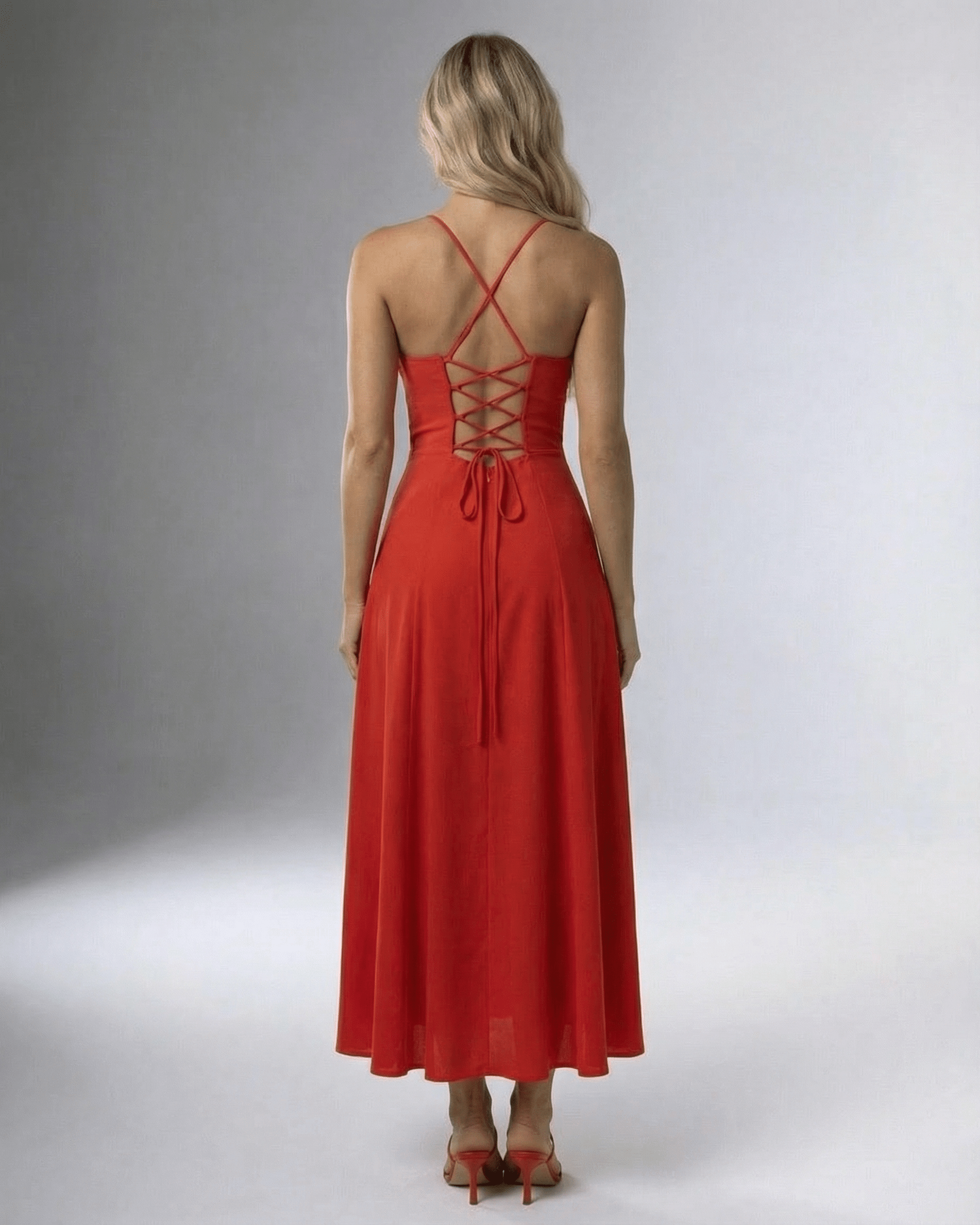 Back view of the Fern Midi Dress in vibrant red, showcasing a square neck and lace-up detailing, perfect for elegant occasions.