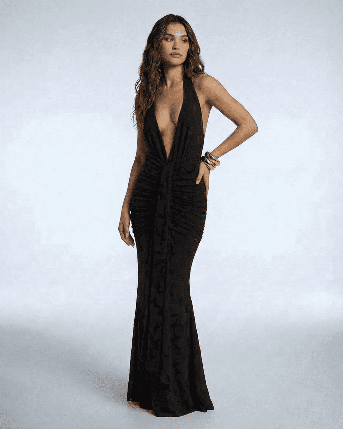 Figi Maxi Dress featuring a deep V-neck, ruched detail, and elegant silhouette. Perfect for evening events. By RAMBLION.