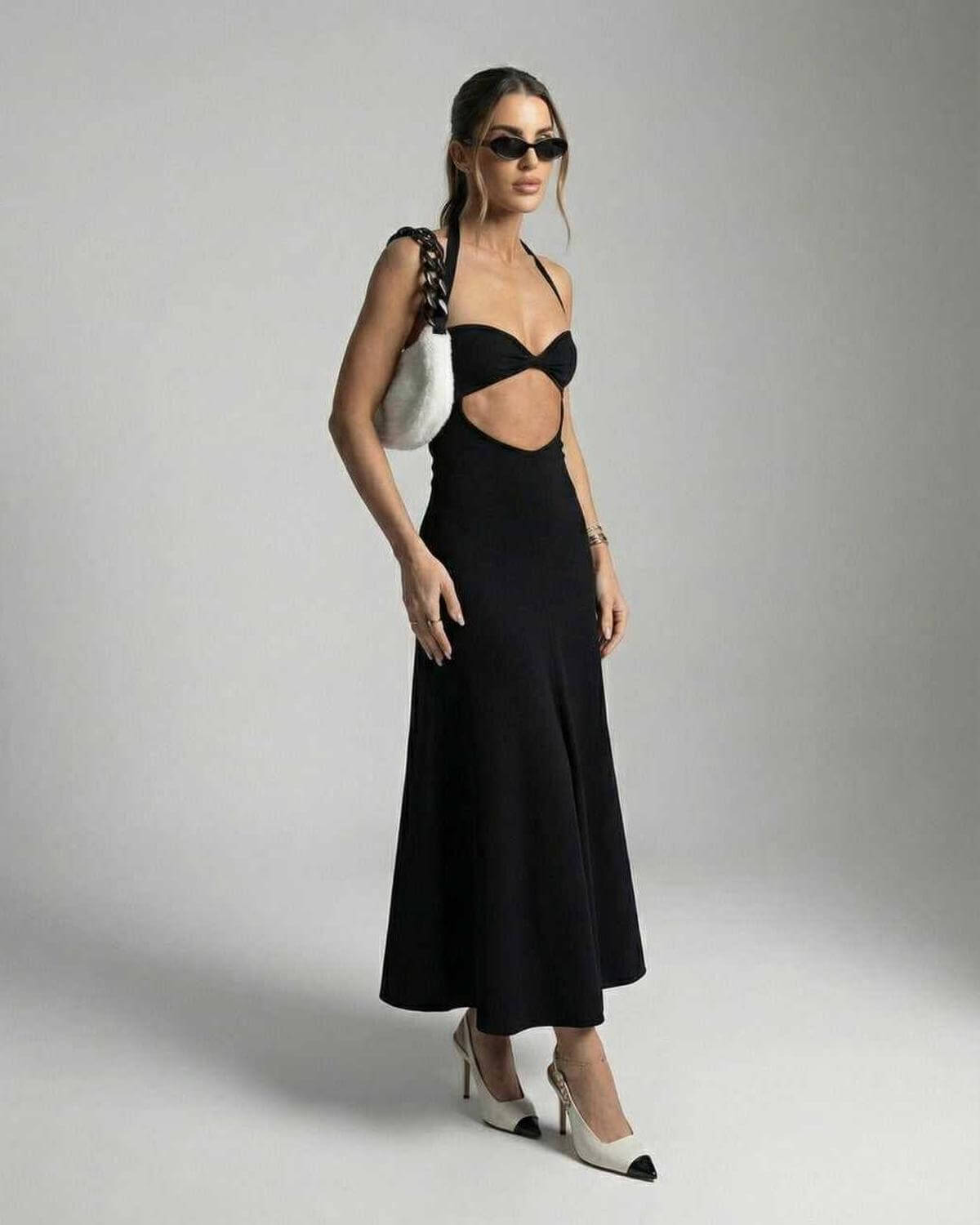 Glow Midi Dress in black with V-neck cutout, perfect for elegant occasions. Designed by RAMBLION.