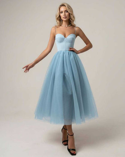 Haze Midi Dress in serene blue with structured corset bodice, tulle skirt, perfect for elegant occasions by RAMBLION.