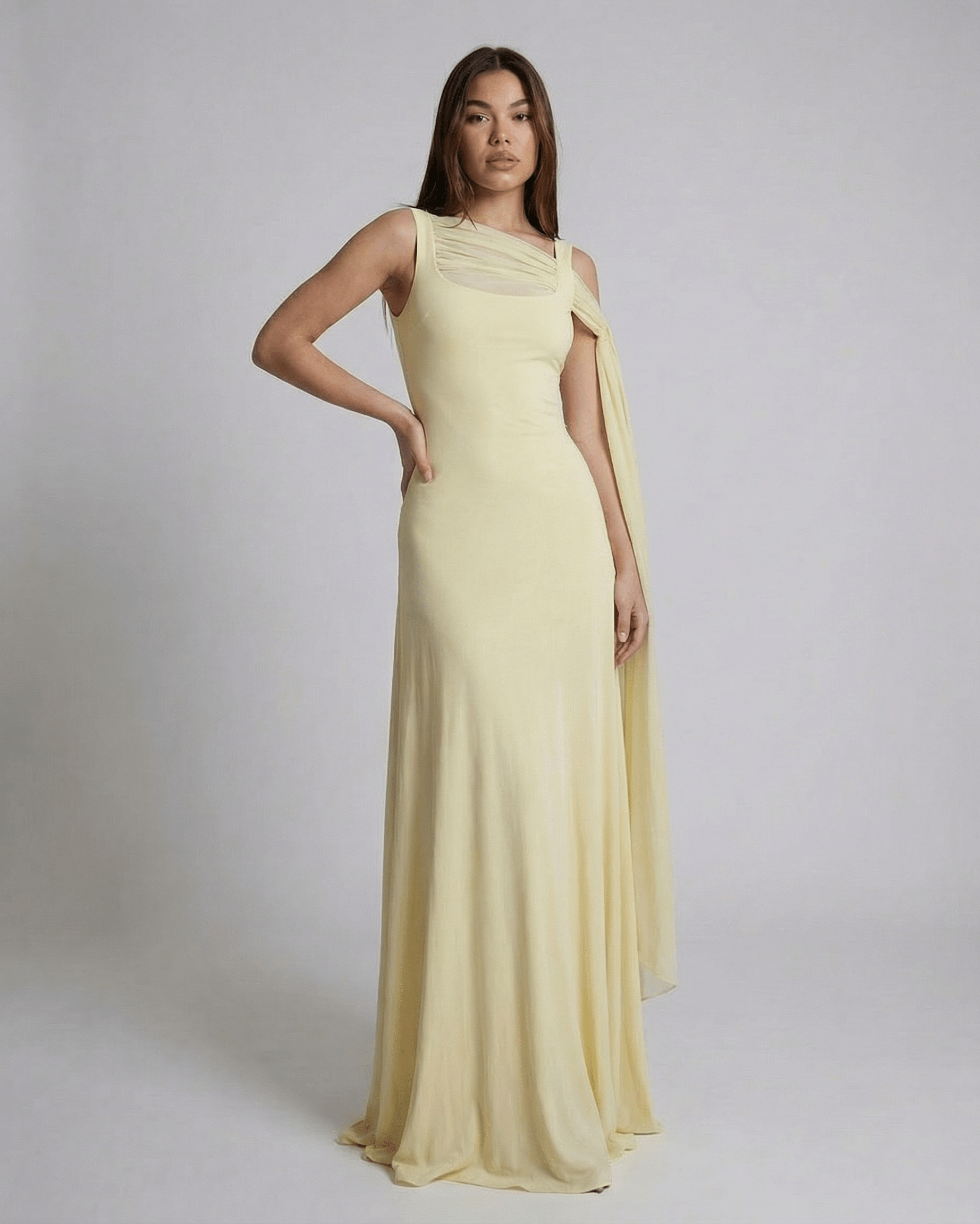 Hira Maxi Dress in light yellow, featuring a square neck and elegant slip design by RAMBLION, perfect for special occasions.