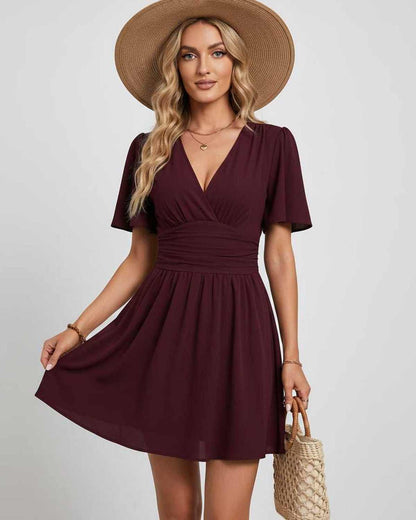 Ramblion Ila mini dress — v-neck neckline · lifestyle styling · styled for prom season