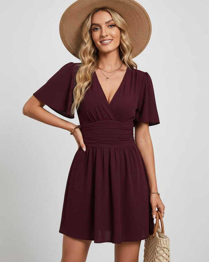 Ramblion Ila mini dress — v-neck neckline · fabric close-up · styled for prom season