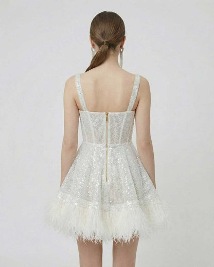 Inca Mini Dress showcasing a sequin overlay and faux-fur hem, perfect for special occasions by RAMBLION.