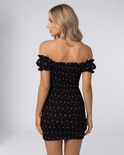 Inna Mini Dress showcasing a floral print, off-shoulder design, and elegant silhouette, perfect for stylish occasions by RAMBLION.